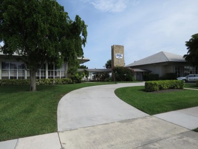 This 2/2 villa sits directly on the golf course which is free to on Leisureville Community Golf Course in Florida - for sale on GolfHomes.com, golf home, golf lot