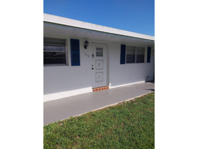 This 2/2 villa sits directly on the golf course which is free to on Leisureville Community Golf Course in Florida - for sale on GolfHomes.com, golf home, golf lot