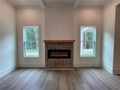 Stunning 2-story home with a 3rd car garage in a coveted on Traditions of Braselton Golf Club in Georgia - for sale on GolfHomes.com, golf home, golf lot