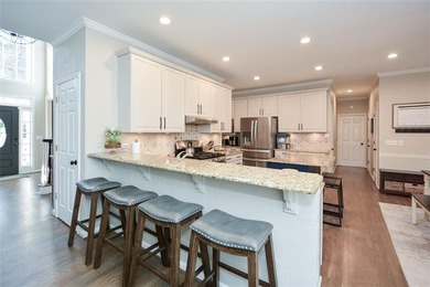 Imagine pulling into the driveway of a stunning traditional on Canongate At Eagle Watch Golf Club in Georgia - for sale on GolfHomes.com, golf home, golf lot