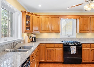 Nestled in St. James Plantation, this spacious home sits on a on Members Club At St. James Plantation in North Carolina - for sale on GolfHomes.com, golf home, golf lot