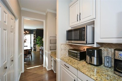 Imagine pulling into the driveway of a stunning traditional on Canongate At Eagle Watch Golf Club in Georgia - for sale on GolfHomes.com, golf home, golf lot