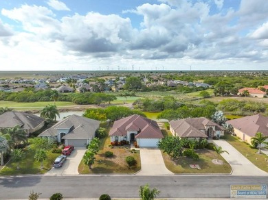 Beautifully crafted 3-bedroom, 2-bath home with a 2-car garage on South Padre Island Golf Club in Texas - for sale on GolfHomes.com, golf home, golf lot