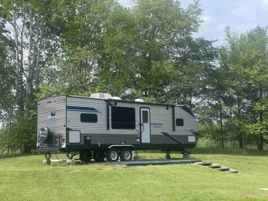 Great camping or building spot in Sugar Springs. Why search for on Sugar Springs Country Club in Michigan - for sale on GolfHomes.com, golf home, golf lot