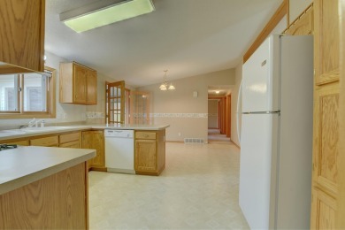 Tee off to easy living perfectly situated on beautiful Country on Country Greens Golf Course in Iowa - for sale on GolfHomes.com, golf home, golf lot