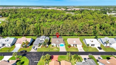 Nestled in the sought-after gated community of Sabal Springs on Sabal Springs Golf and Racquet Club in Florida - for sale on GolfHomes.com, golf home, golf lot