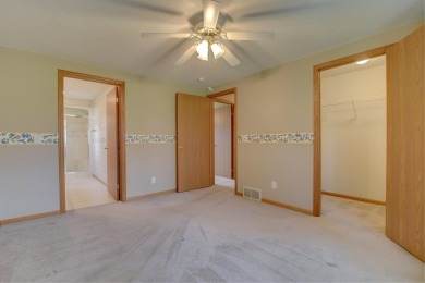 Tee off to easy living perfectly situated on beautiful Country on Country Greens Golf Course in Iowa - for sale on GolfHomes.com, golf home, golf lot