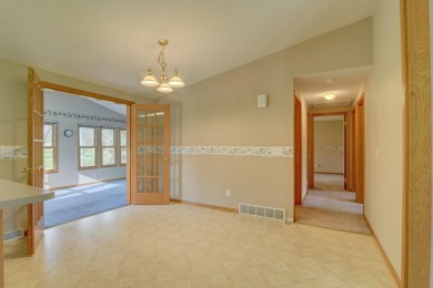 Tee off to easy living perfectly situated on beautiful Country on Country Greens Golf Course in Iowa - for sale on GolfHomes.com, golf home, golf lot