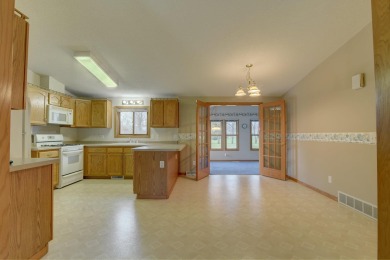 Tee off to easy living perfectly situated on beautiful Country on Country Greens Golf Course in Iowa - for sale on GolfHomes.com, golf home, golf lot