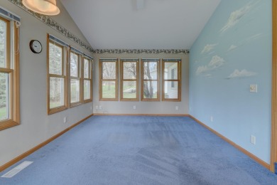 Tee off to easy living perfectly situated on beautiful Country on Country Greens Golf Course in Iowa - for sale on GolfHomes.com, golf home, golf lot