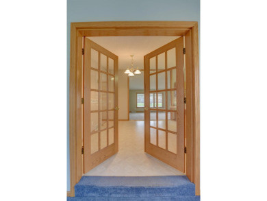 Tee off to easy living perfectly situated on beautiful Country on Country Greens Golf Course in Iowa - for sale on GolfHomes.com, golf home, golf lot
