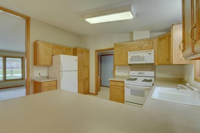 Tee off to easy living perfectly situated on beautiful Country on Country Greens Golf Course in Iowa - for sale on GolfHomes.com, golf home, golf lot