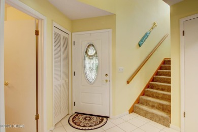With a private, tranquil water and golf course view, this bright on Spruce Creek Golf Club in Florida - for sale on GolfHomes.com, golf home, golf lot