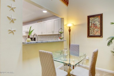 With a private, tranquil water and golf course view, this bright on Spruce Creek Golf Club in Florida - for sale on GolfHomes.com, golf home, golf lot