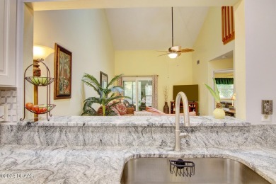 With a private, tranquil water and golf course view, this bright on Spruce Creek Golf Club in Florida - for sale on GolfHomes.com, golf home, golf lot