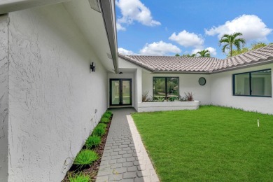 Move right into a FULLY renovated 4 bedroom 3 bath  + office on Boca Woods Country Club in Florida - for sale on GolfHomes.com, golf home, golf lot