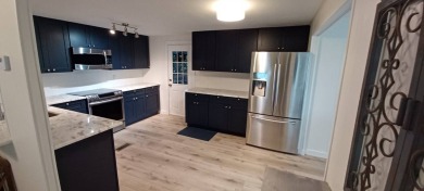 Come settle down and relax in a beautiful, manufactured home on Fairways Country Club in Florida - for sale on GolfHomes.com, golf home, golf lot