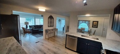 Come settle down and relax in a beautiful, manufactured home on Fairways Country Club in Florida - for sale on GolfHomes.com, golf home, golf lot