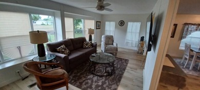 Come settle down and relax in a beautiful, manufactured home on Fairways Country Club in Florida - for sale on GolfHomes.com, golf home, golf lot
