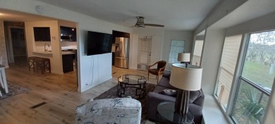 Come settle down and relax in a beautiful, manufactured home on Fairways Country Club in Florida - for sale on GolfHomes.com, golf home, golf lot