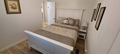 Come settle down and relax in a beautiful, manufactured home on Fairways Country Club in Florida - for sale on GolfHomes.com, golf home, golf lot