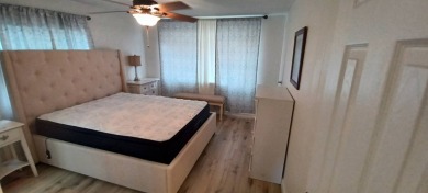 Come settle down and relax in a beautiful, manufactured home on Fairways Country Club in Florida - for sale on GolfHomes.com, golf home, golf lot