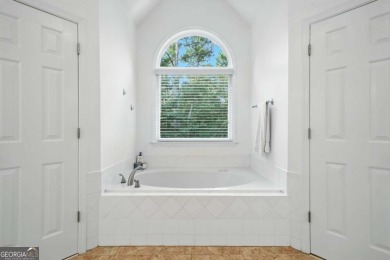 Beautifully situated BridgeMill home less than 1 mile from the on Bridgemill Golf Club in Georgia - for sale on GolfHomes.com, golf home, golf lot