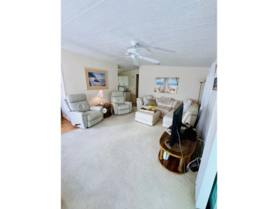 Looking for a cozy winter getaway or a year-round haven? This on Pine Lakes Country Club in Florida - for sale on GolfHomes.com, golf home, golf lot