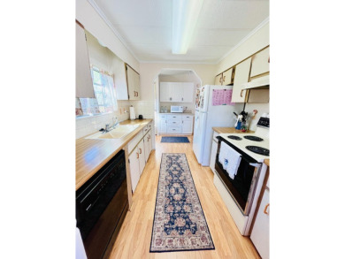 Looking for a cozy winter getaway or a year-round haven? This on Pine Lakes Country Club in Florida - for sale on GolfHomes.com, golf home, golf lot