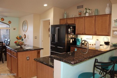 Welcome to this extended Loredo model with larger dining, den & on Quail Creek Country Club  in Arizona - for sale on GolfHomes.com, golf home, golf lot