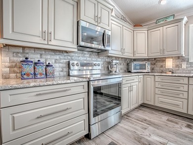 Beautifully Designed & Updated Anna Maria Courtyard Villa in the on Pennbrooke Fairways in Florida - for sale on GolfHomes.com, golf home, golf lot