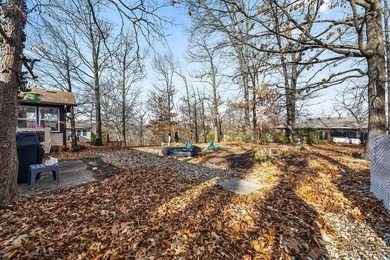 Tucked in Dunvegan near Loch Lomond, this refreshed single-level on Bella Vista Country Club - Scottsdale in Arkansas - for sale on GolfHomes.com, golf home, golf lot