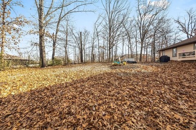 Tucked in Dunvegan near Loch Lomond, this refreshed single-level on Bella Vista Country Club - Scottsdale in Arkansas - for sale on GolfHomes.com, golf home, golf lot