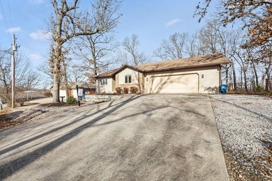 Tucked in Dunvegan near Loch Lomond, this refreshed single-level on Bella Vista Country Club - Scottsdale in Arkansas - for sale on GolfHomes.com, golf home, golf lot