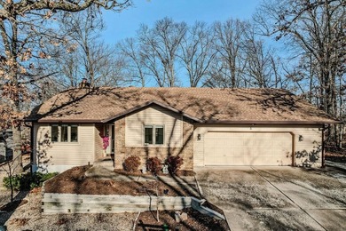 Tucked in Dunvegan near Loch Lomond, this refreshed single-level on Bella Vista Country Club - Scottsdale in Arkansas - for sale on GolfHomes.com, golf home, golf lot