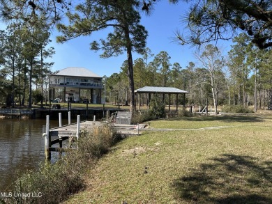 Beautiful waterfront lot with deep water access located on the on Diamondhead Country Club in Mississippi - for sale on GolfHomes.com, golf home, golf lot