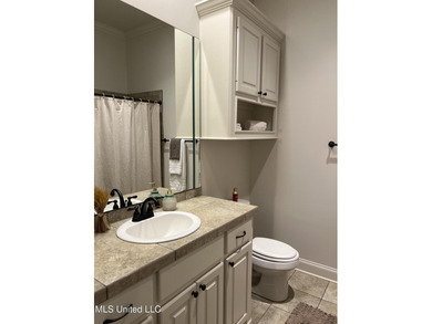 ✨ Overflowing with charm and thoughtful upgrades, this on Lake Caroline Golf Club in Mississippi - for sale on GolfHomes.com, golf home, golf lot