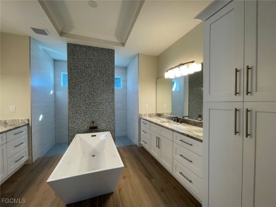 Stunning New Construction Pool Home in Southwest Cape Coral! 3 on Royal Tee Country Club in Florida - for sale on GolfHomes.com, golf home, golf lot