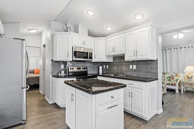 Beautifully updated and fully furnished park model with island on Long Island Golf Course in Texas - for sale on GolfHomes.com, golf home, golf lot