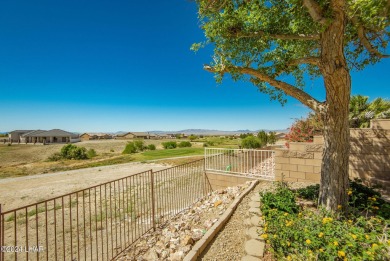 Indulge in a luxurious living experience in this stunning on Los Lagos Golf Club in Arizona - for sale on GolfHomes.com, golf home, golf lot
