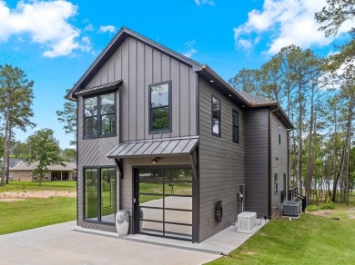 Experience unparalleled lakeside living at 147 Brushwood Ct on Rayburn Country Club in Texas - for sale on GolfHomes.com, golf home, golf lot