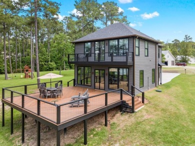 Experience unparalleled lakeside living at 147 Brushwood Ct on Rayburn Country Club in Texas - for sale on GolfHomes.com, golf home, golf lot