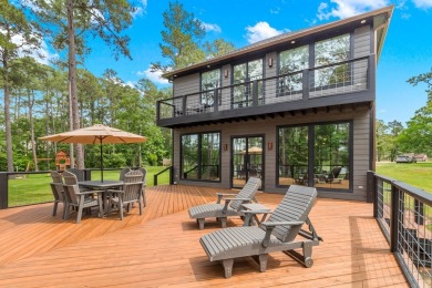 Experience unparalleled lakeside living at 147 Brushwood Ct on Rayburn Country Club in Texas - for sale on GolfHomes.com, golf home, golf lot