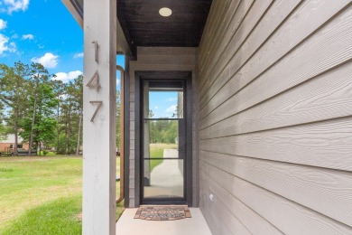 Experience unparalleled lakeside living at 147 Brushwood Ct on Rayburn Country Club in Texas - for sale on GolfHomes.com, golf home, golf lot