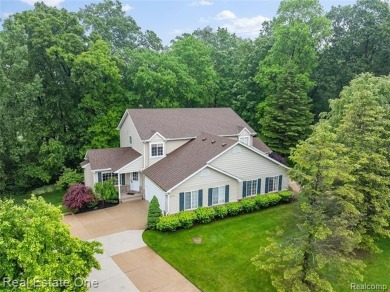 Move-in ready colonial tucked at the end of a peaceful on Whispering Pines Golf  in Michigan - for sale on GolfHomes.com, golf home, golf lot