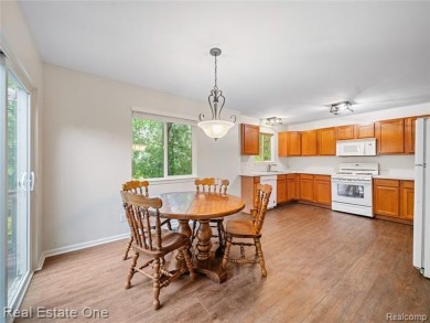 Move-in ready colonial tucked at the end of a peaceful on Whispering Pines Golf  in Michigan - for sale on GolfHomes.com, golf home, golf lot