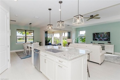 ZERO-CORNER SLIDERS - POND VIEW - 2.5-CAR GARAGE - TILE on Panther Run Golf Club in Florida - for sale on GolfHomes.com, golf home, golf lot