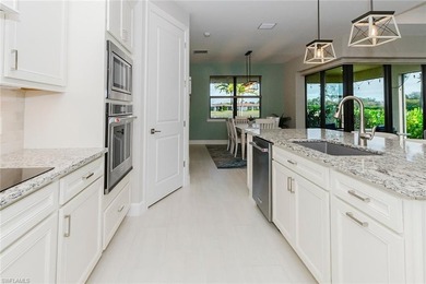 ZERO-CORNER SLIDERS - POND VIEW - 2.5-CAR GARAGE - TILE on Panther Run Golf Club in Florida - for sale on GolfHomes.com, golf home, golf lot