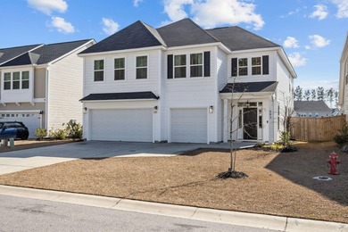 Set on a peaceful pond homesite in the Lochton subsection of on Cypress Point Par 3 in South Carolina - for sale on GolfHomes.com, golf home, golf lot