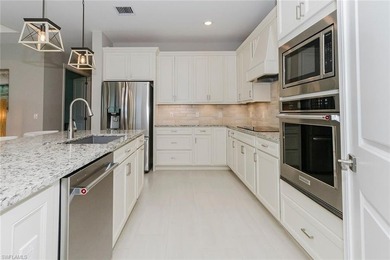 ZERO-CORNER SLIDERS - POND VIEW - 2.5-CAR GARAGE - TILE on Panther Run Golf Club in Florida - for sale on GolfHomes.com, golf home, golf lot